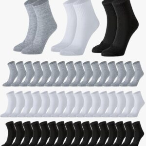 A collection of gray, white, and black ankle socks arranged in rows.