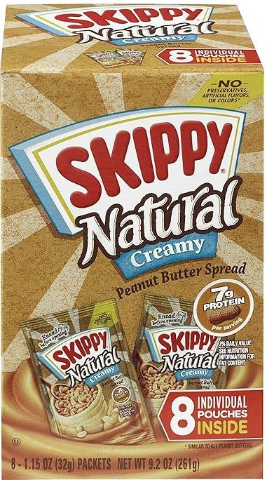 Skippy Natural Creamy peanut butter spread jar with label.