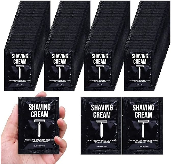 Seven black packages of shaving cream labeled 'Shaving Cream T'.